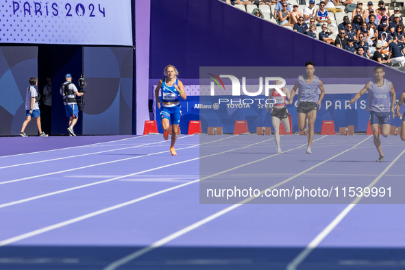 Valentina Petrillo of Team Italy competes in the Women's 400m T12 Heat 4 at Stade de France during the Paris 2024 Paralympic Games in Paris,...