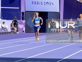 Valentina Petrillo of Team Italy competes in the Women's 400m T12 Heat 4 at Stade de France during the Paris 2024 Paralympic Games in Paris,...