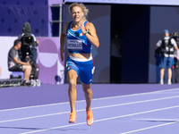 Valentina Petrillo of Team Italy competes in the Women's 400m T12 Heat 4 at Stade de France during the Paris 2024 Paralympic Games in Paris,...