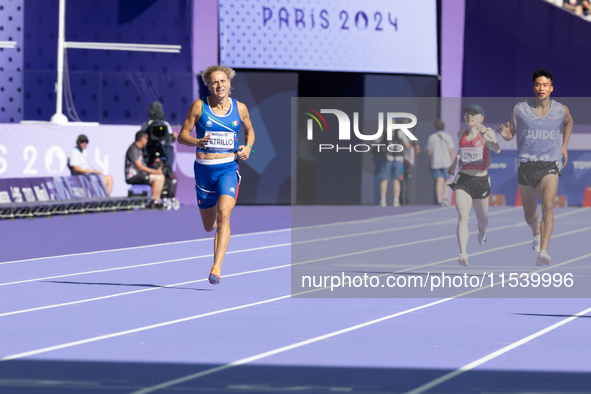 Valentina Petrillo of Team Italy competes in the Women's 400m T12 Heat 4 at Stade de France during the Paris 2024 Paralympic Games in Paris,...