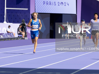 Valentina Petrillo of Team Italy competes in the Women's 400m T12 Heat 4 at Stade de France during the Paris 2024 Paralympic Games in Paris,...