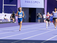 Valentina Petrillo of Team Italy competes in the Women's 400m T12 Heat 4 at Stade de France during the Paris 2024 Paralympic Games in Paris,...