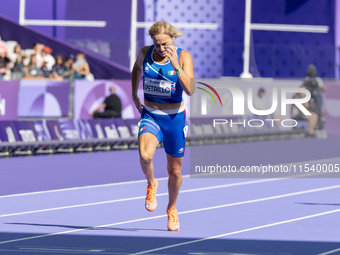 Valentina Petrillo of Team Italy competes in the Women's 400m T12 Heat 4 at Stade de France during the Paris 2024 Paralympic Games in Paris,...