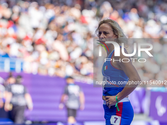 Valentina Petrillo of Team Italy reacts after qualifying for the finals in the Women's 400m T12 Heat 4 at Stade de France during the Paris 2...