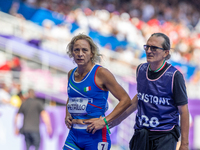 Valentina Petrillo of Team Italy reacts after qualifying for the finals in the Women's 400m T12 Heat 4 at Stade de France during the Paris 2...