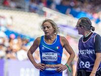 Valentina Petrillo of Team Italy reacts after qualifying for the finals in the Women's 400m T12 Heat 4 at Stade de France during the Paris 2...