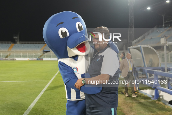 Silvio Baldini, head coach of Delfino Pescara 1936, and the mascot ''Ciuffo'' prior to the Serie C NOW match between Delfino Pescara 1936 an...