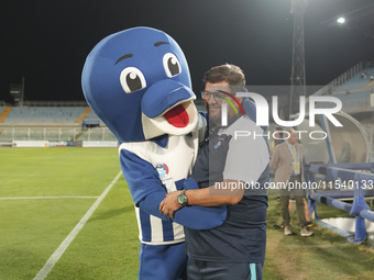 Silvio Baldini, head coach of Delfino Pescara 1936, and the mascot ''Ciuffo'' prior to the Serie C NOW match between Delfino Pescara 1936 an...