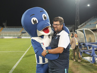 Silvio Baldini, head coach of Delfino Pescara 1936, and the mascot ''Ciuffo'' prior to the Serie C NOW match between Delfino Pescara 1936 an...