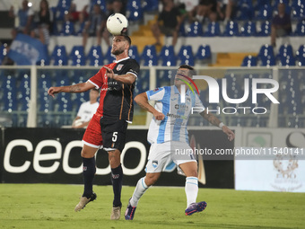 Gianmarco Cangiano of Delfino Pescara 1936 and Paolo Dametto of Torres are in action during the Serie C NOW match between Delfino Pescara 19...