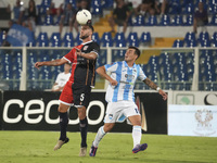 Gianmarco Cangiano of Delfino Pescara 1936 and Paolo Dametto of Torres are in action during the Serie C NOW match between Delfino Pescara 19...