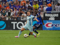 Cincinnati midfielder Obinna Nwobodo and Montreal midfielder Samuel Piette compete for the ball during the Major League Soccer match between...