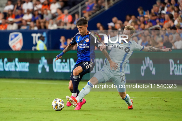 Cincinnati midfielder Luca Orellano and Montreal defender Dawid Bugaj compete for the ball during the Major League Soccer match between FC C...