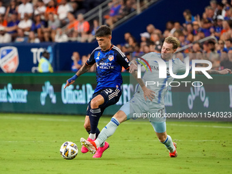 Cincinnati midfielder Luca Orellano and Montreal defender Dawid Bugaj compete for the ball during the Major League Soccer match between FC C...