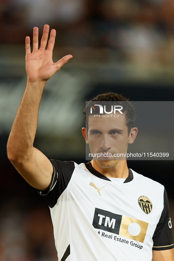 Cesar Tarrega of Valencia CF waves his hand prior to the LaLiga EA Sports match between Valencia CF and Villarreal CF at Mestalla stadium in...