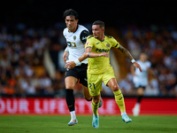 Yeremy Pino (R) of Villarreal CF runs next to Jesus Vazquez of Valencia CF during the LaLiga EA Sports match between Valencia CF and Villarr...