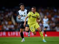 Yeremy Pino (R) of Villarreal CF runs next to Jesus Vazquez of Valencia CF during the LaLiga EA Sports match between Valencia CF and Villarr...