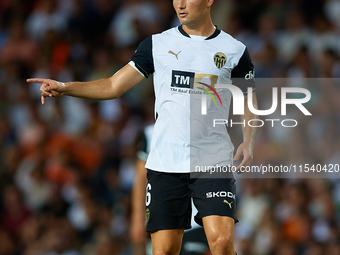 Hugo Guillamon of Valencia CF is in action during the LaLiga EA Sports match between Valencia CF and Villarreal CF at Mestalla stadium in Va...