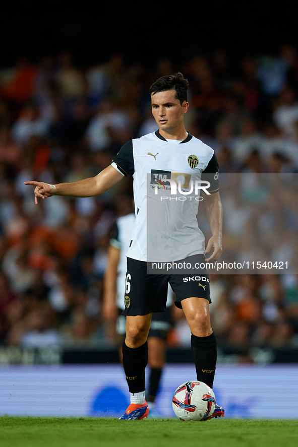 Hugo Guillamon of Valencia CF is in action during the LaLiga EA Sports match between Valencia CF and Villarreal CF at Mestalla stadium in Va...