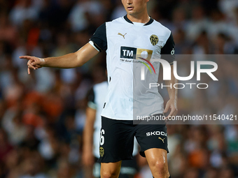 Hugo Guillamon of Valencia CF is in action during the LaLiga EA Sports match between Valencia CF and Villarreal CF at Mestalla stadium in Va...