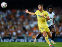 Santi Comesana Veiga of Villarreal CF competes for the ball with Thierry Rendall of Valencia CF during the LaLiga EA Sports match between Va...