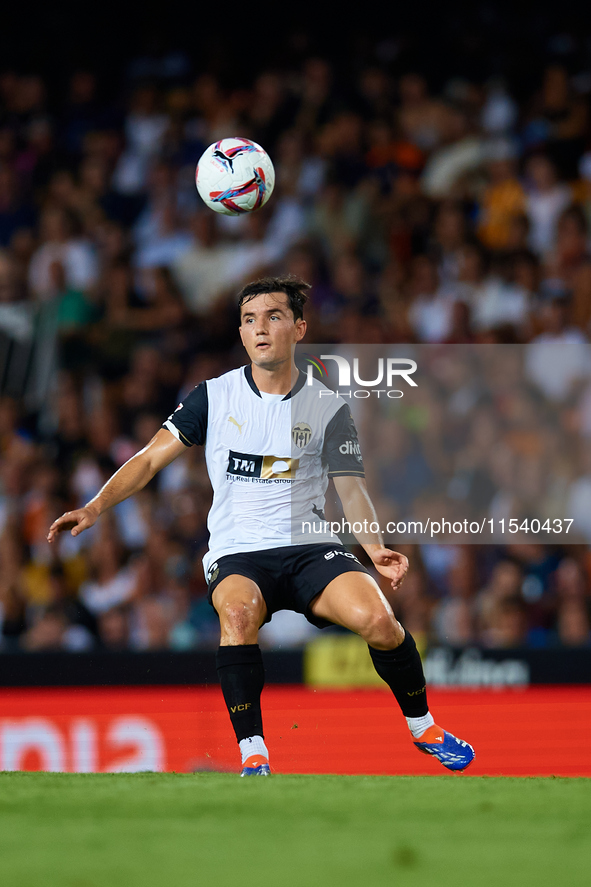 Hugo Guillamon of Valencia CF is in action during the LaLiga EA Sports match between Valencia CF and Villarreal CF at Mestalla stadium in Va...