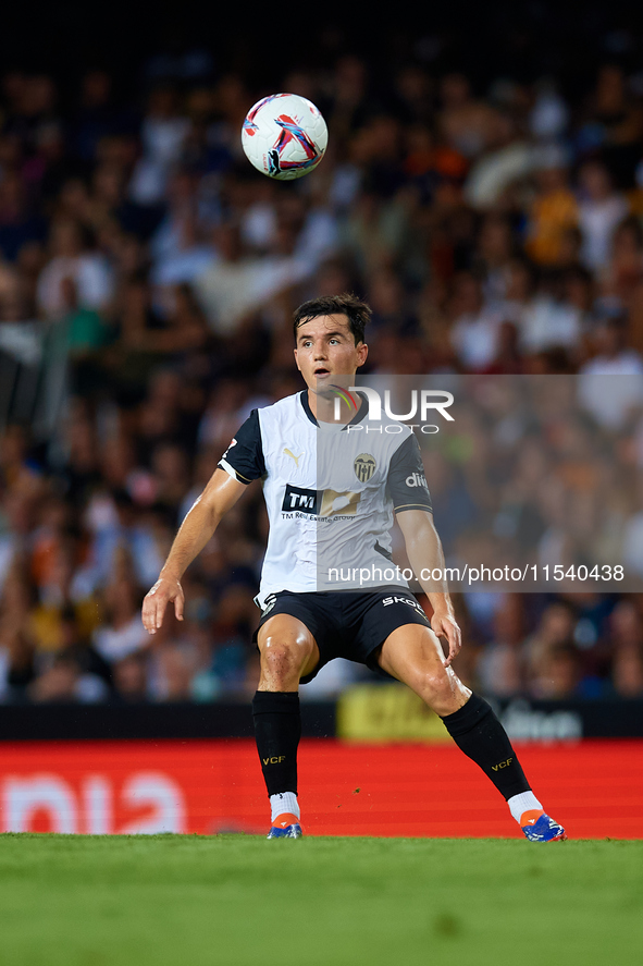 Hugo Guillamon of Valencia CF is in action during the LaLiga EA Sports match between Valencia CF and Villarreal CF at Mestalla stadium in Va...