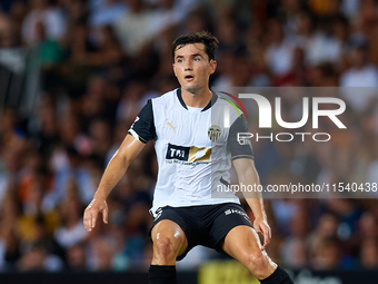 Hugo Guillamon of Valencia CF is in action during the LaLiga EA Sports match between Valencia CF and Villarreal CF at Mestalla stadium in Va...