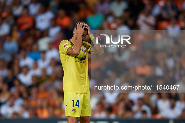 Santi Comesana Veiga of Villarreal CF reacts during the LaLiga EA Sports match between Valencia CF and Villarreal CF at Mestalla stadium in...