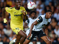 Thierno Barry of Villarreal CF competes for the ball with Cristhian Mosquera of Valencia CF during the LaLiga EA Sports match between Valenc...