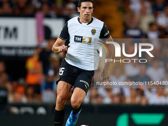 Cesar Tarrega of Valencia CF is in action during the LaLiga EA Sports match between Valencia CF and Villarreal CF at Mestalla stadium in Val...