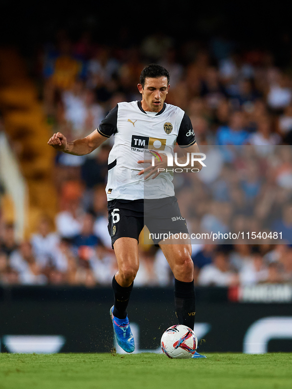 Cesar Tarrega of Valencia CF is in action during the LaLiga EA Sports match between Valencia CF and Villarreal CF at Mestalla stadium in Val...