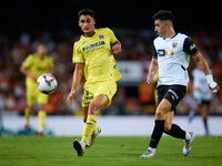 Sergi Cardona of Villarreal CF competes for the ball with Diego Lopez of Valencia CF during the LaLiga EA Sports match between Valencia CF a...