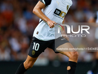 Andre Almeida of Valencia CF is in action during the LaLiga EA Sports match between Valencia CF and Villarreal CF at Mestalla stadium in Val...