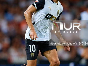 Andre Almeida of Valencia CF is in action during the LaLiga EA Sports match between Valencia CF and Villarreal CF at Mestalla stadium in Val...