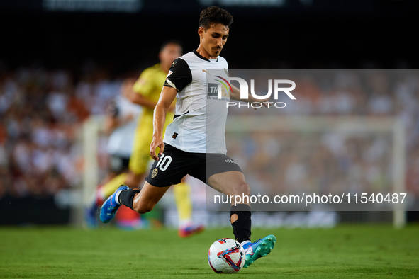 Andre Almeida of Valencia CF is in action during the LaLiga EA Sports match between Valencia CF and Villarreal CF at Mestalla stadium in Val...