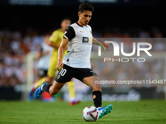 Andre Almeida of Valencia CF is in action during the LaLiga EA Sports match between Valencia CF and Villarreal CF at Mestalla stadium in Val...