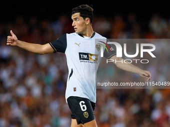 Hugo Guillamon of Valencia CF reacts during the LaLiga EA Sports match between Valencia CF and Villarreal CF at Mestalla stadium in Valencia...