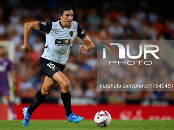 Cesar Tarrega of Valencia CF is in action during the LaLiga EA Sports match between Valencia CF and Villarreal CF at Mestalla stadium in Val...