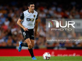 Cesar Tarrega of Valencia CF is in action during the LaLiga EA Sports match between Valencia CF and Villarreal CF at Mestalla stadium in Val...