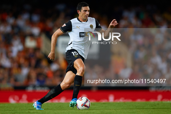 Cesar Tarrega of Valencia CF is in action during the LaLiga EA Sports match between Valencia CF and Villarreal CF at Mestalla stadium in Val...