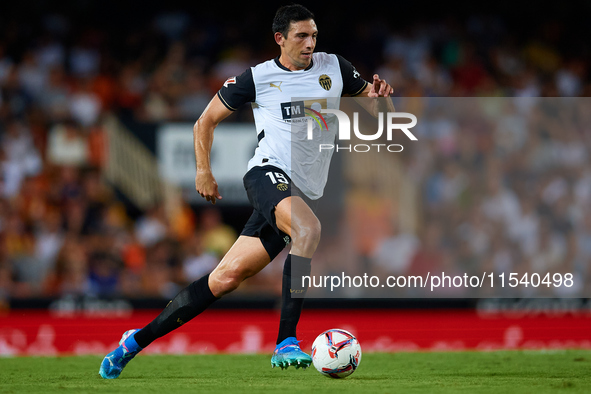 Cesar Tarrega of Valencia CF is in action during the LaLiga EA Sports match between Valencia CF and Villarreal CF at Mestalla stadium in Val...