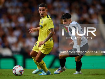 Yeremy Pino of Villarreal CF competes for the ball with Diego Lopez of Valencia CF during the LaLiga EA Sports match between Valencia CF and...