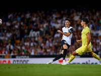 Pepelu (L) of Valencia CF competes for the ball with Ramon Terrats of Villarreal CF during the LaLiga EA Sports match between Valencia CF an...