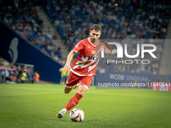 Rayo Vallecano forward takes a powerful shot on goal during the match against Espanyol. (