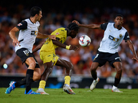 Thierno Barry of Villarreal CF competes for the ball with Cesar Tarrega of Valencia CF during the LaLiga EA Sports match between Valencia CF...