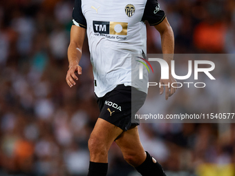 Andre Almeida of Valencia CF is in action during the LaLiga EA Sports match between Valencia CF and Villarreal CF at Mestalla stadium in Val...