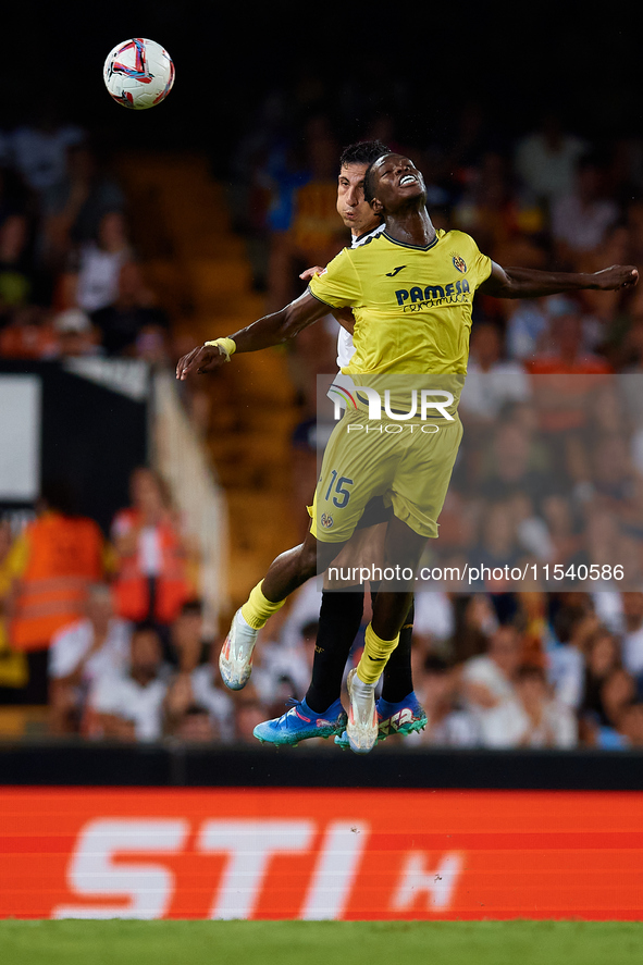 Thierno Barry of Villarreal CF competes for the ball with Cesar Tarrega of Valencia CF during the LaLiga EA Sports match between Valencia CF...