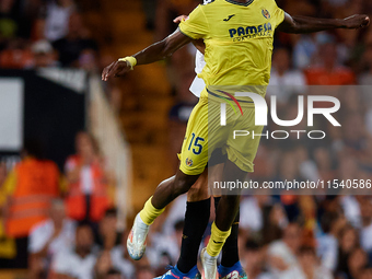 Thierno Barry of Villarreal CF competes for the ball with Cesar Tarrega of Valencia CF during the LaLiga EA Sports match between Valencia CF...