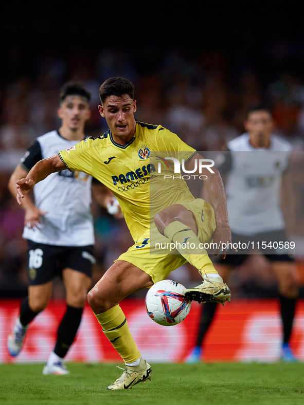 Sergi Cardona of Villarreal CF is in action during the LaLiga EA Sports match between Valencia CF and Villarreal CF at Mestalla stadium in V...